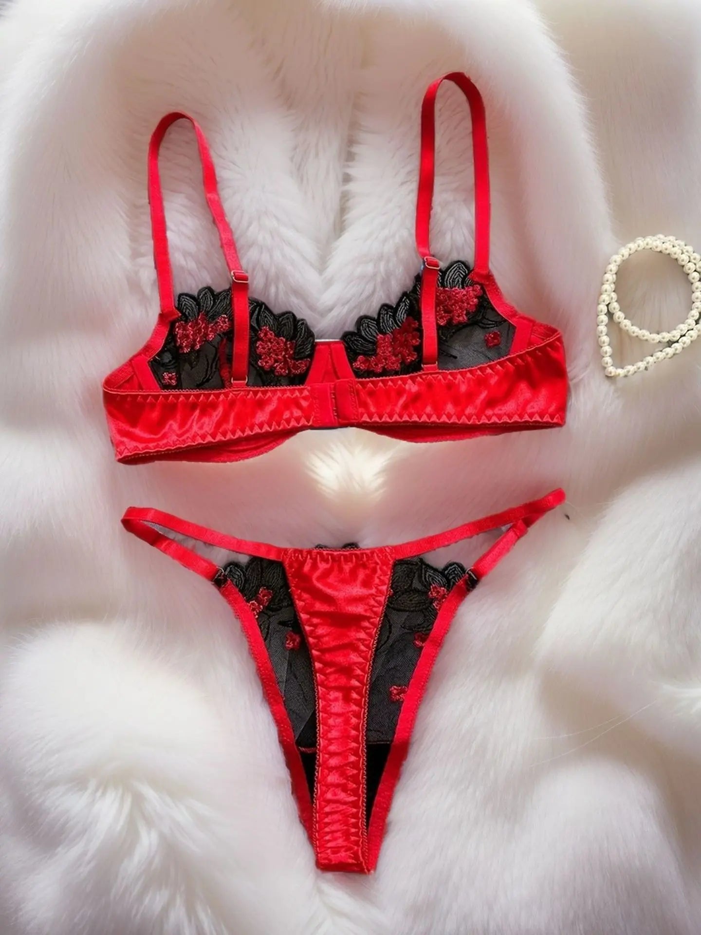 A set of sexy rose-red lingerie, including a bra and panties with daisy patterns, as well as a comfortable home-style