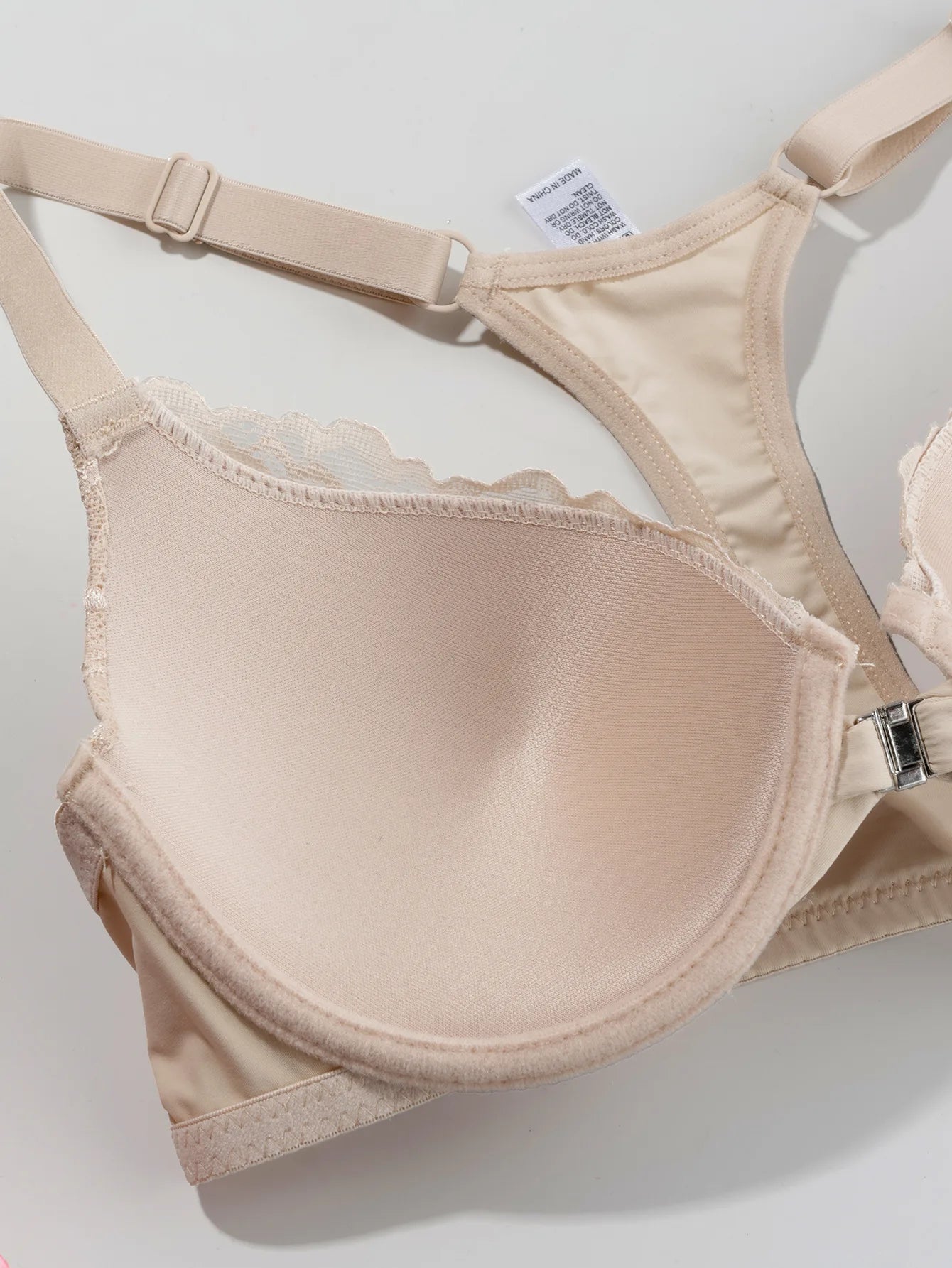 Lightly padded, underwired lace push-up bra with front closure and beautiful back design