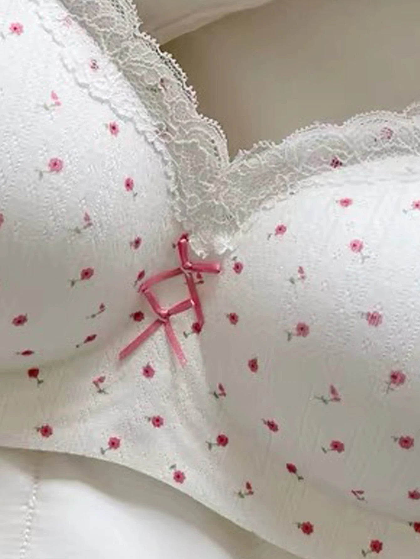 Lightweight wireless comfortable bra with small floral print, color-block lace, and double bows