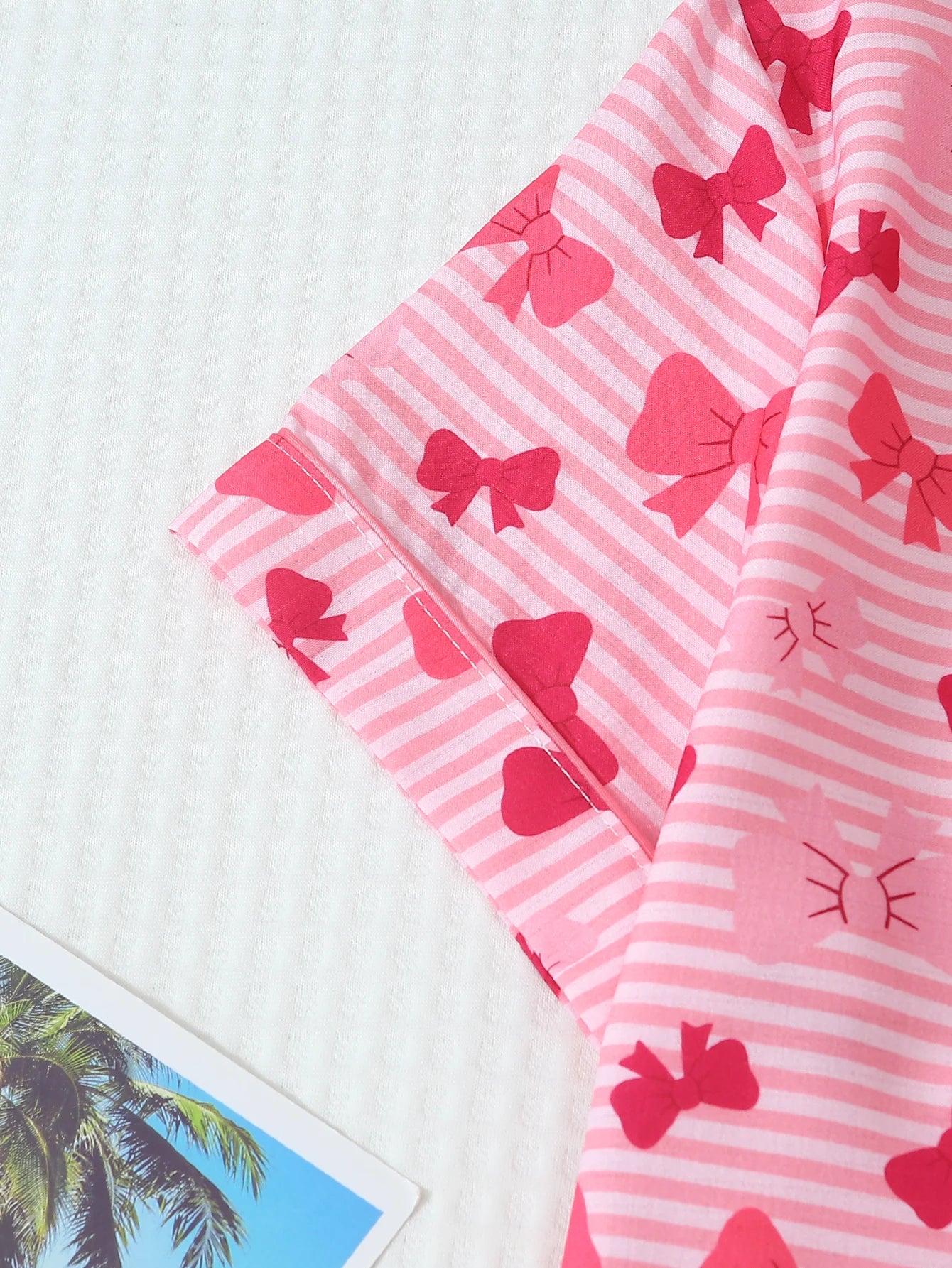 Two-Piece Set: Comfortable Pink and White Striped Top with Red Bow Print, Turn-Down Collar, Buttoned Short Sleeves, and Pockets, Paired with Bow Shorts. Spring/Summer Women's Pajama Loungewear Set Suitable for Home Use