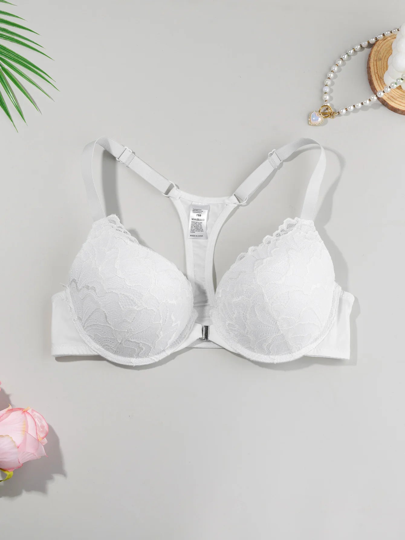 Lightly padded, underwired lace push-up bra with front closure and beautiful back design