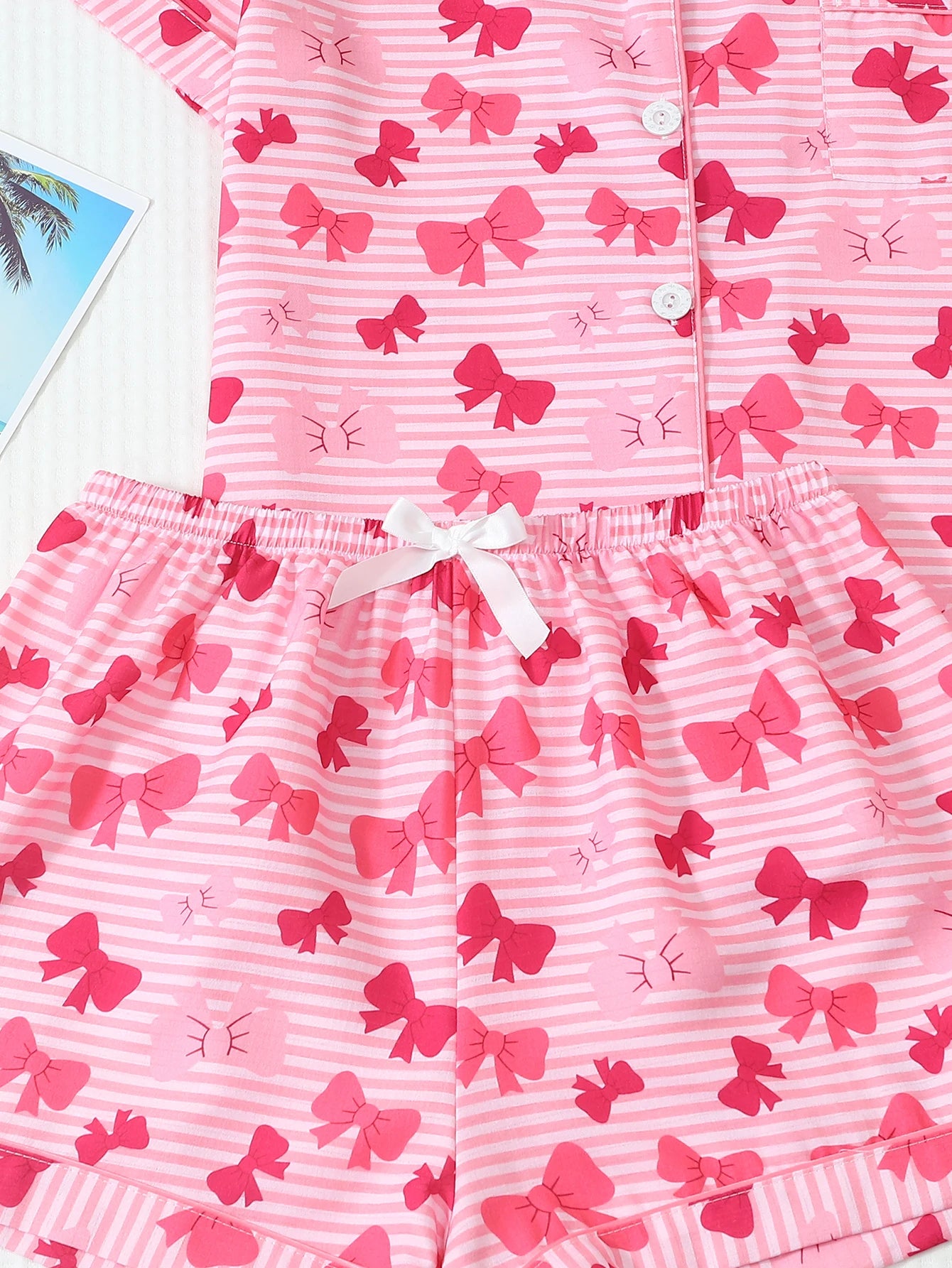 Two-Piece Set: Comfortable Pink and White Striped Top with Red Bow Print, Turn-Down Collar, Buttoned Short Sleeves, and Pockets, Paired with Bow Shorts. Spring/Summer Women's Pajama Loungewear Set Suitable for Home Use