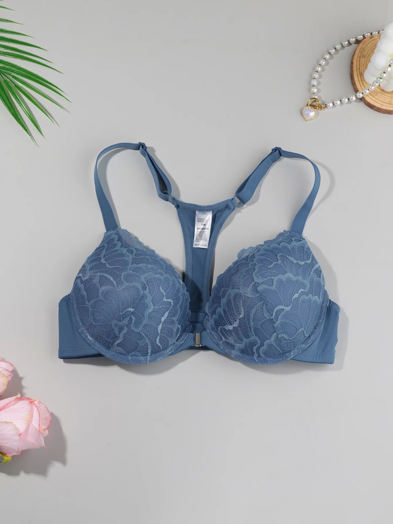 Lightly padded, underwired lace push-up bra with front closure and beautiful back design