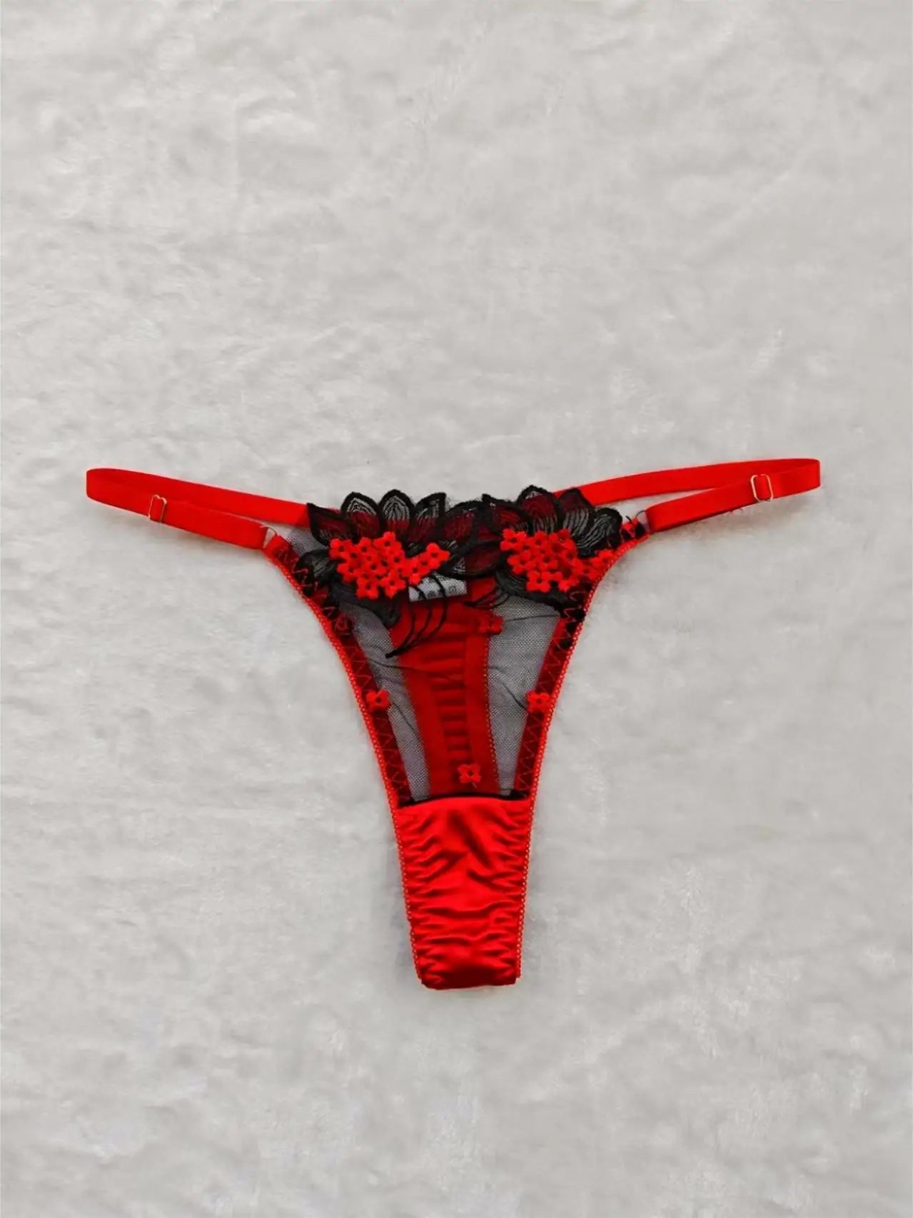 A set of sexy rose-red lingerie, including a bra and panties with daisy patterns, as well as a comfortable home-style